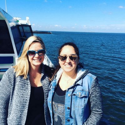Two women posing for a photo on the ferry