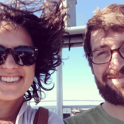 A young man and woman take a selfie on the ferry