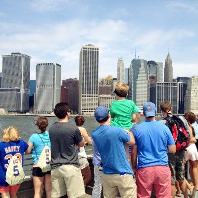 Mets fans look out on the water from the top deck of the ferry