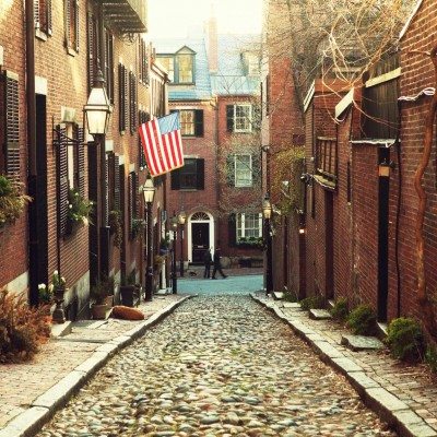 Looking down a historic cobblestone alleyway in Boston, Massachusetts