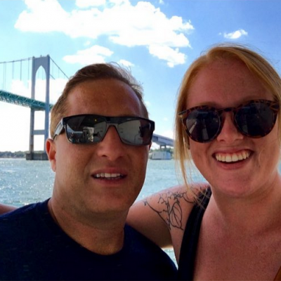 A young man and woman take a selfie on the ferry