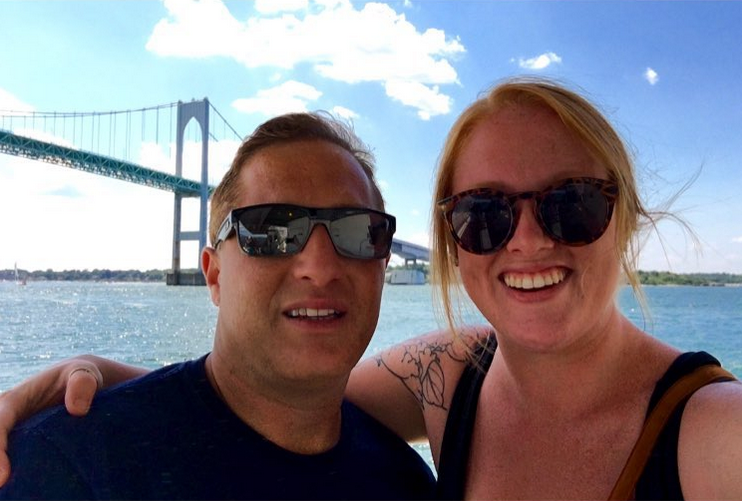 A young man and woman take a selfie on the ferry