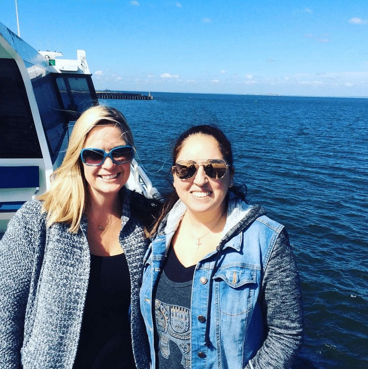 Two women posing for a photo on the ferry