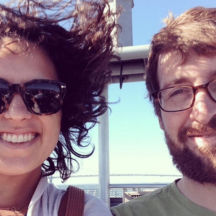 A young man and woman take a selfie on the ferry