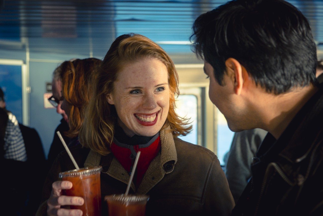 Passengers enjoying beverages inside the ferry