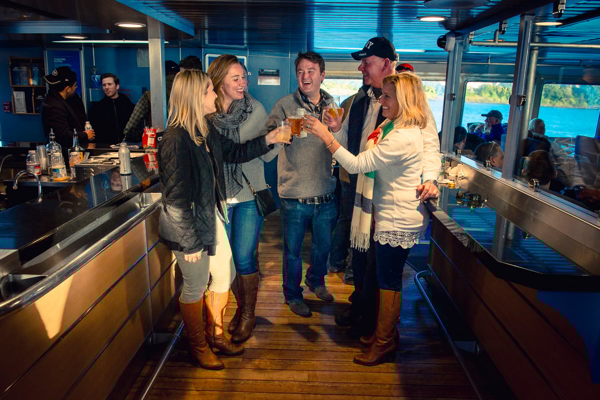 Passengers enjoying beverages inside the ferry