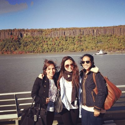 Three passengers posing for the camera on the ferry