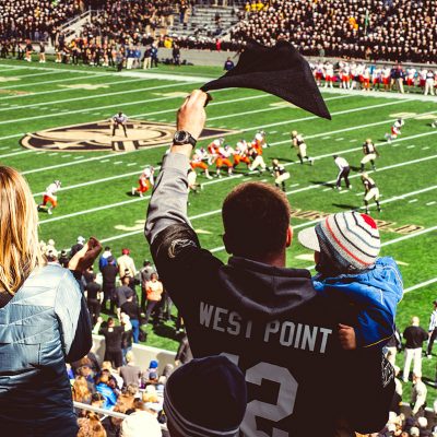 Fans cheering on Army